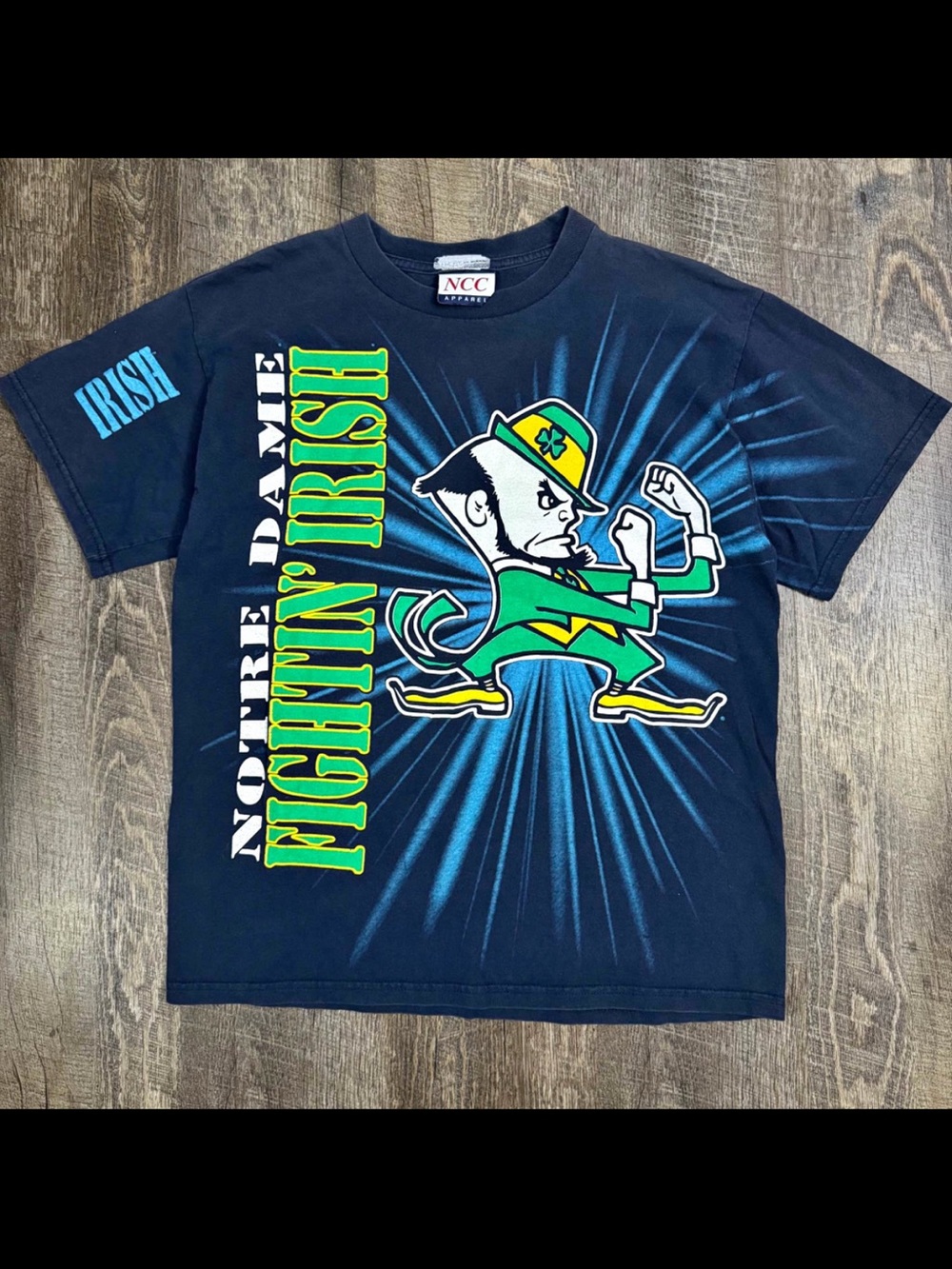 CHANEL Navy Blue Graphic Short Sleeve Tee with Green & Yellow Print